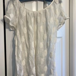Women’s cream embroidered blouse.